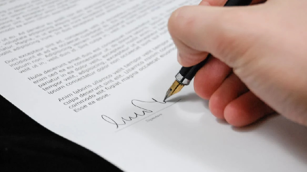 Person signing a T1 customs document for goods moving under customs transit